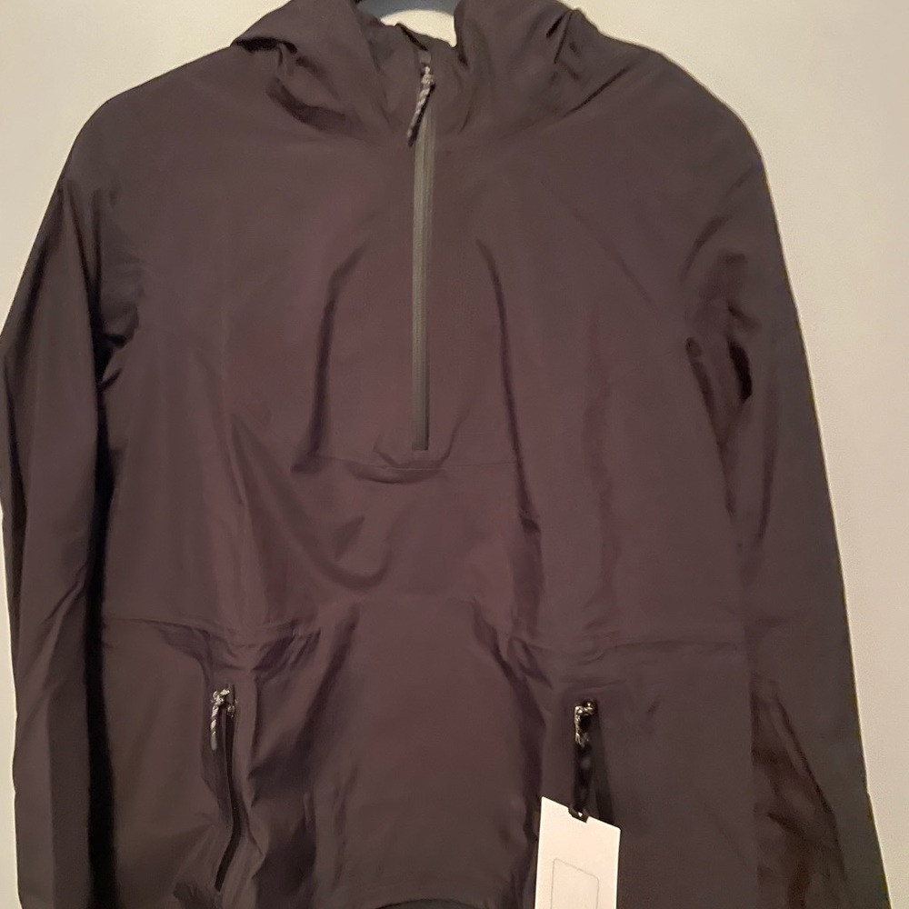New with tags, hiking, size 6, waterproof, lightweight rain jacket